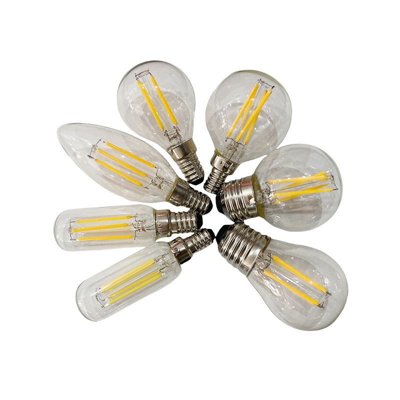How do LED filament bulbs, by mimicking Edison's tungsten filament structure, create a warm and nostalgic visual atmosphere?